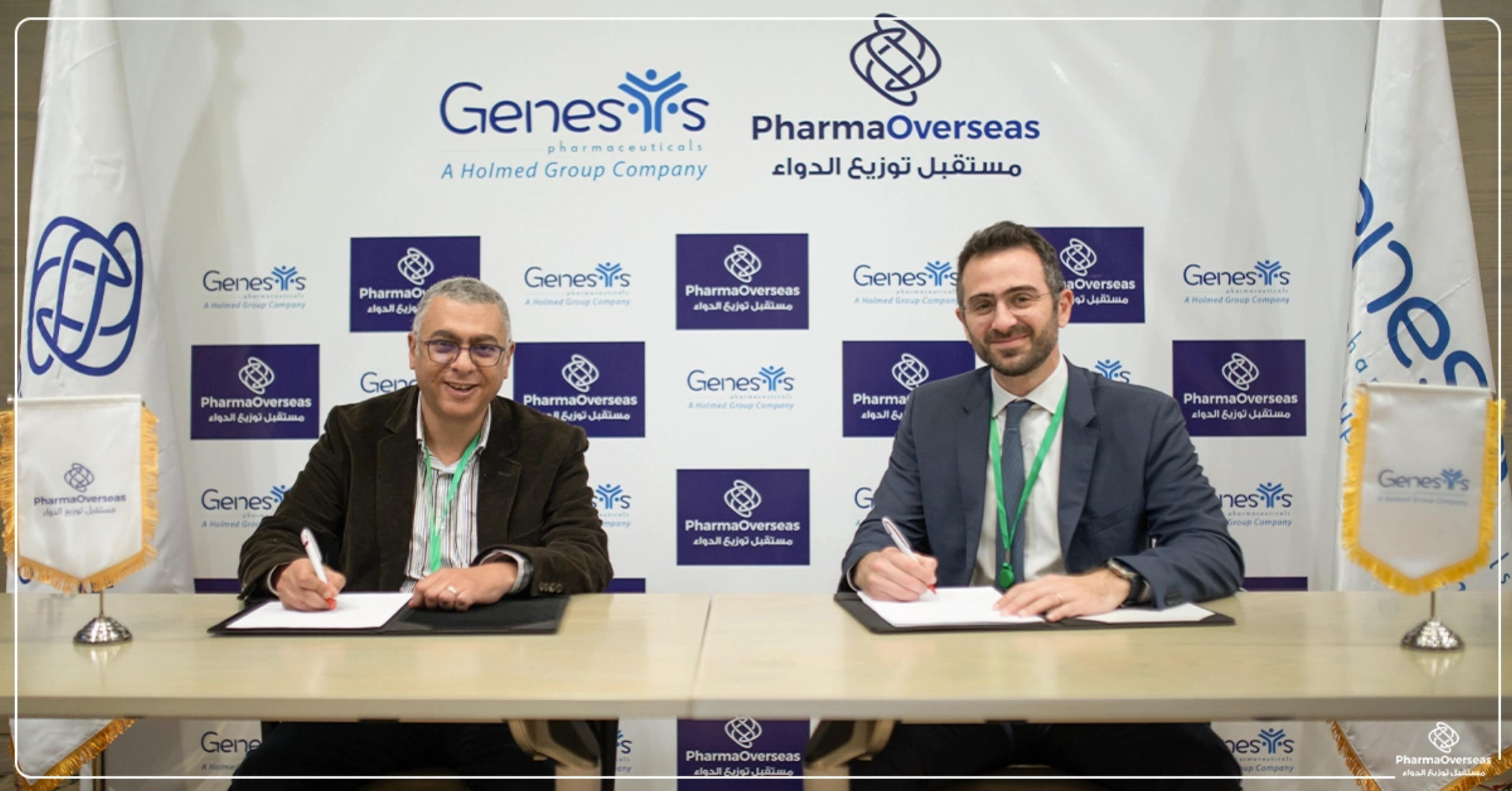 PharmaOverseas and Genesis Pharmaceuticals representatives signing an agreement